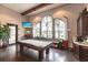 Clubhouse features a pool table, TV, and ample windows for natural light and beautiful community views at 5814 Cavano Dr, Sarasota, FL 34231