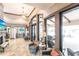Cozy seating area inside the lobby offering comfortable armchairs and access to the outdoor patio with tables and lounge chairs at 5814 Cavano Dr, Sarasota, FL 34231