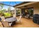 Outdoor patio featuring a table, chairs, grill, and cozy seating area with access to the house at 5814 Cavano Dr, Sarasota, FL 34231