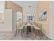 Cozy dining area featuring modern furnishings, artwork, and an open view into the kitchen at 6211 Skyward Ct, Bradenton, FL 34203
