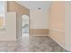 Bright dining area with tile floors and neutral paint, connecting to the kitchen at 6211 Skyward Ct, Bradenton, FL 34203