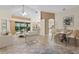 Open-concept living space with bar seating, dining area, and access to the lanai at 6211 Skyward Ct, Bradenton, FL 34203