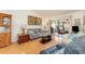 Cozy living room featuring hardwood floors, comfortable seating, and access to the screened lanai at 6314 29Th W Ave, Bradenton, FL 34209