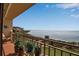 Charming balcony view with lush plants, overlooking tranquil water views at 6430 Sun Eagle Ln # 201, Bradenton, FL 34210