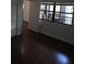 Bedroom features a sliding door leading to a screened porch, hardwood floors, and closet at 6430 Sun Eagle Ln # 201, Bradenton, FL 34210
