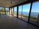 Bright and airy living space with waterfront views and sliding glass doors to balcony at 6430 Sun Eagle Ln # 201, Bradenton, FL 34210