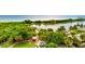 Scenic aerial view showing green park with walking paths, a lake and beach at 1364 Berkshire Ct, Venice, FL 34292