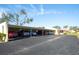 Covered parking with multiple cars and a well-maintained asphalt driveway at 1430 57Th W St # 1430, Bradenton, FL 34209