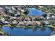 Gorgeous aerial view of waterfront home in a residential neighborhood at 146 Willow Bend Way, Osprey, FL 34229