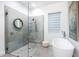 Modern bathroom with a soaking tub, walk-in shower, and stylish fixtures at 2254 Hawthorne St, Sarasota, FL 34239