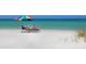 Relaxing beach view with chairs, umbrella, and the ocean at 2254 Hawthorne St, Sarasota, FL 34239