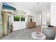 Serene bedroom featuring modern decor, a comfortable chair, and a view of the outdoors at 2254 Hawthorne St, Sarasota, FL 34239