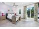 Cozy bedroom with bright decor, stylish furnishings, and a private outdoor access to green scenery at 2254 Hawthorne St, Sarasota, FL 34239