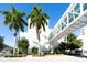 Exterior of a modern white building with palm trees and a skywalk at 2254 Hawthorne St, Sarasota, FL 34239