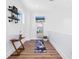 Exercise room with wood floors, a display mirror, a yoga mat, and open shelving at 2254 Hawthorne St, Sarasota, FL 34239
