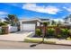 Contemporary home featuring a two-car garage, unique landscaping, and a modern gray and white color scheme at 2254 Hawthorne St, Sarasota, FL 34239