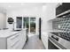 Contemporary kitchen featuring modern appliances, sleek countertops, and easy access to the outdoor patio at 2254 Hawthorne St, Sarasota, FL 34239