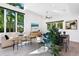 Bright and spacious living room with large windows, high ceilings, and comfortable modern furnishings at 2254 Hawthorne St, Sarasota, FL 34239