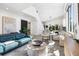 Bright, open-concept living room with modern decor, high ceilings, and tiled floors at 2254 Hawthorne St, Sarasota, FL 34239