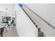 Bright open-concept living area with stairs, modern decor, and an open floor plan at 2254 Hawthorne St, Sarasota, FL 34239