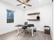 Minimalist home office with a modern desk, comfortable chair, and natural light at 2254 Hawthorne St, Sarasota, FL 34239