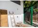 Outdoor shower area adjacent to yard space, with ladder at 2254 Hawthorne St, Sarasota, FL 34239