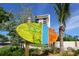 Colorful Siesta Key Village sign with modern building in the background at 2254 Hawthorne St, Sarasota, FL 34239