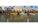 Waterfront featuring colorful homes, boats docked, and vibrant community creating a picturesque coastal setting at 2254 Hawthorne St, Sarasota, FL 34239
