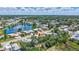 Aerial view of the home, showcasing its location within a vibrant neighborhood and near a tranquil lake at 2321 Terry Ln, Sarasota, FL 34231