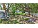 Lush backyard oasis with mature trees and green space, perfect for outdoor enjoyment at 2321 Terry Ln, Sarasota, FL 34231