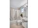 Classic bathroom featuring a combined tub and shower and white fixtures at 2321 Terry Ln, Sarasota, FL 34231