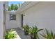 Welcoming front entrance with potted plants and a well-lit walkway leading to the home's entrance at 2321 Terry Ln, Sarasota, FL 34231