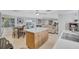 Open-concept kitchen and dining area with an island, stainless steel appliances, and natural light at 2321 Terry Ln, Sarasota, FL 34231