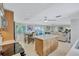 Bright kitchen featuring island, stainless appliances, and open layout to dining and living areas at 2321 Terry Ln, Sarasota, FL 34231