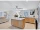 Bright and spacious kitchen with island, open layout to dining and living areas, and modern finishes at 2321 Terry Ln, Sarasota, FL 34231