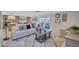 Inviting living room with a cozy sofa, stylish decor, and a view of the adjacent sunroom at 2321 Terry Ln, Sarasota, FL 34231