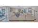 Bright and airy living room featuring a comfortable couch, contemporary decor, and plenty of natural light at 2321 Terry Ln, Sarasota, FL 34231