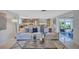 Spacious living room with an open layout, seamlessly connecting to the kitchen and sunroom at 2321 Terry Ln, Sarasota, FL 34231