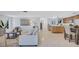 Open-concept living space with modern furniture, flowing into a kitchen and dining area at 2321 Terry Ln, Sarasota, FL 34231
