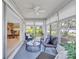 Charming sunroom with sliding glass doors connecting to the main living area and views of the outdoors at 2321 Terry Ln, Sarasota, FL 34231