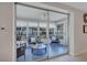 Bright sunroom with ample windows, comfortable seating, and serene views of the surrounding greenery at 2321 Terry Ln, Sarasota, FL 34231