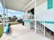 Home exterior featuring a covered carport and a side entrance with stairs at 2601 Gulf N Dr # 427, Bradenton Beach, FL 34217