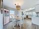Bright dining area with a round table, white chairs, and stylish decor at 2601 Gulf N Dr # 427, Bradenton Beach, FL 34217
