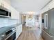 Modern kitchen with stainless steel appliances and bright dining area at 2601 Gulf N Dr # 427, Bradenton Beach, FL 34217