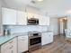 The updated kitchen has a stainless steel range and microwave, and ample counter space at 2601 Gulf N Dr # 427, Bradenton Beach, FL 34217