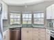 Bright kitchen features stainless steel appliances and a charming water view from the windows at 2601 Gulf N Dr # 427, Bradenton Beach, FL 34217