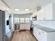 Modern kitchen with white cabinetry, stainless steel appliances, and ample natural light at 2601 Gulf N Dr # 427, Bradenton Beach, FL 34217