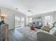 Cozy living room boasts stylish furniture, hardwood floors, and plenty of natural light at 2601 Gulf N Dr # 427, Bradenton Beach, FL 34217