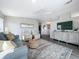 Living room boasts stylish furniture, hardwood floors, and a decorative cabinet at 2601 Gulf N Dr # 427, Bradenton Beach, FL 34217