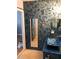Stylish bathroom featuring tiled wall, mirror, vanity with vessel sink, and artwork at 2950 Viscaya Pl # 205, Sarasota, FL 34237